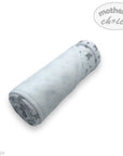 Rolled-up blanket with gray pattern on a white background, featuring 'mother's choice' branding.