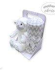 White plush lamb toy and gray patterned blanket in a packaging box with 'Mother's Choice' branding.