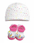 Baby hat and booties set with unicorn design on a white background