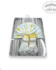 Baby hat and socks set on a hanger with 'Mother's Choice' branding.