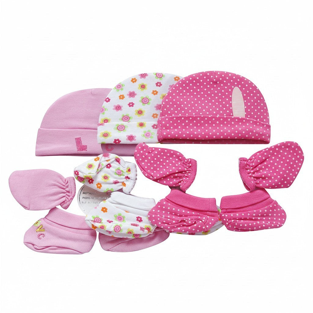 Set of pink baby hats and booties with floral patterns on a white background