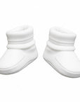 Pair of white baby booties on a white background