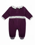 Purple baby romper with white trim on a white background