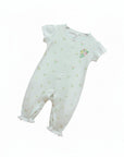 White baby romper with floral patterns on a white background