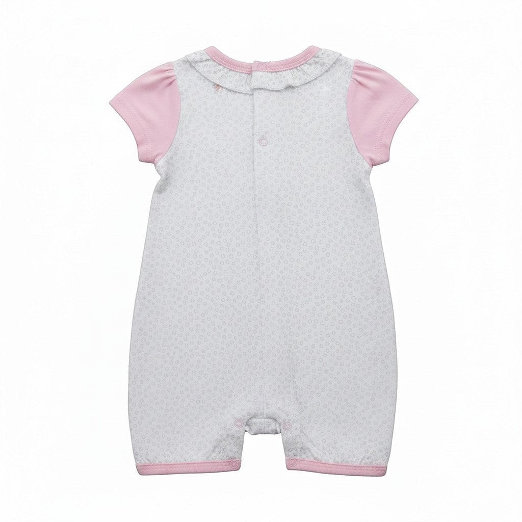 Baby romper with pink sleeves and trim on a white background