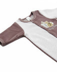 Baby onesie with a cartoon design on a white background