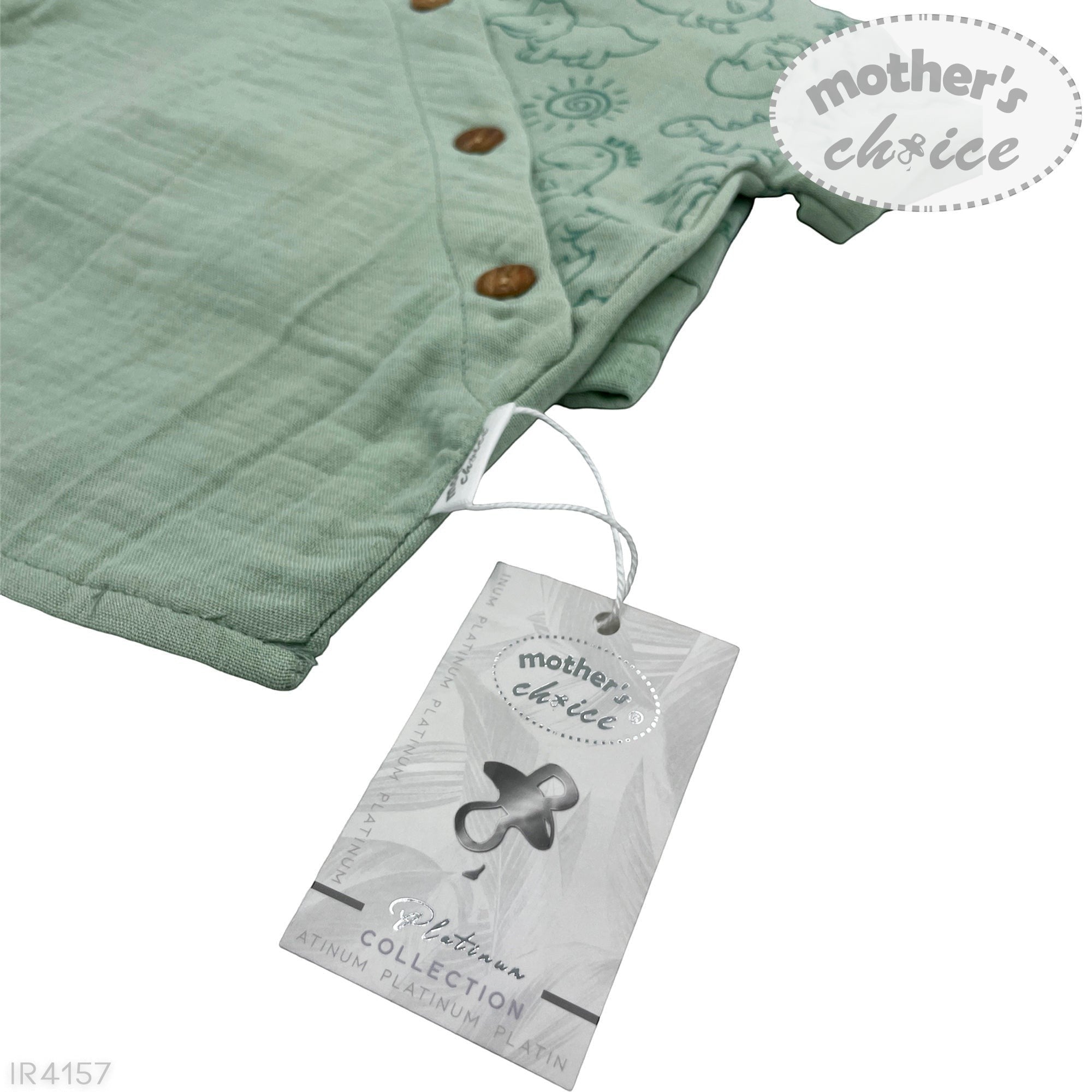 Green baby blanket with buttons and a 'mother's choice' tag on a white background