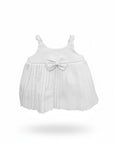 White pleated dress with a bow on a white background