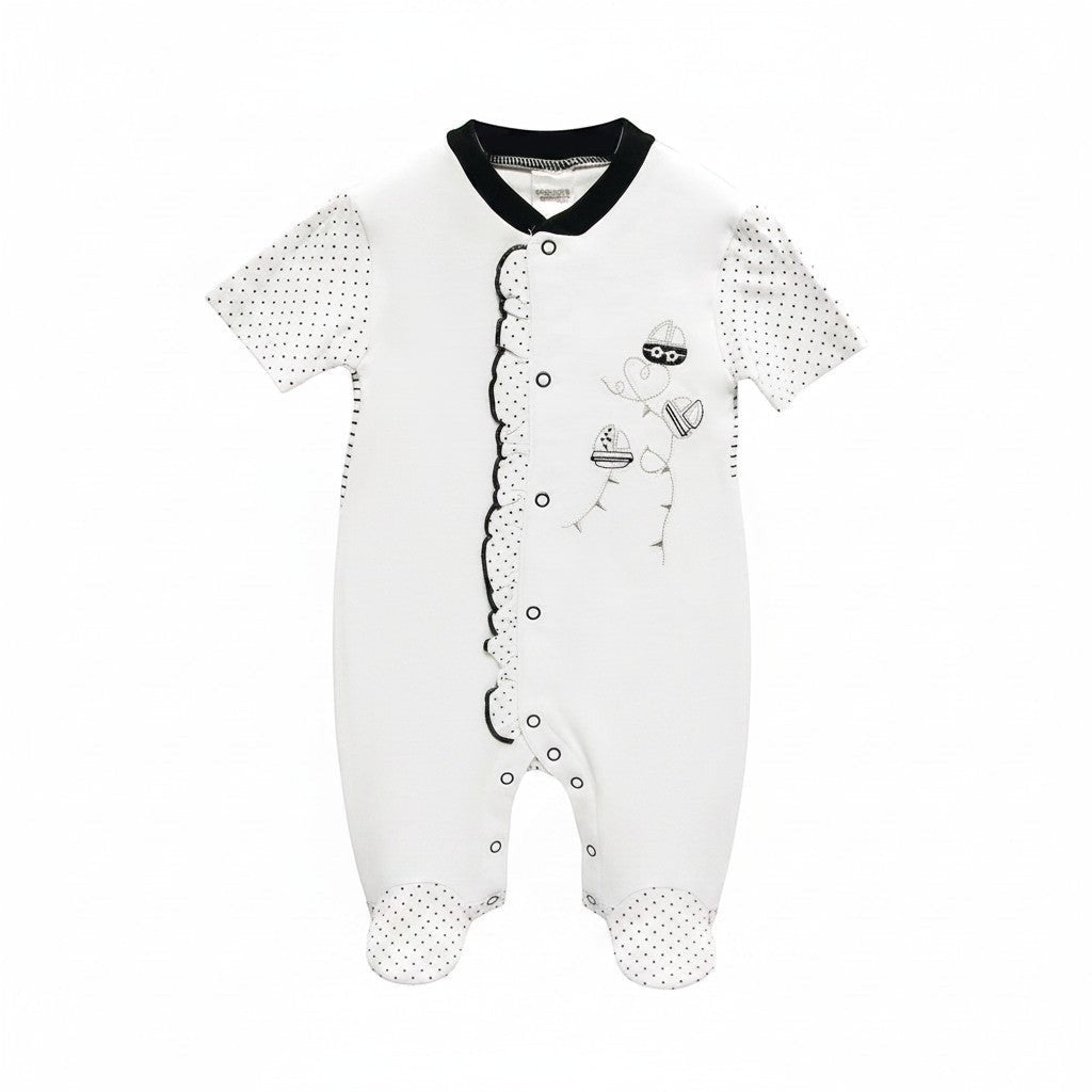 White baby onesie with black patterns on a white background