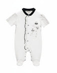 White baby onesie with black patterns on a white background