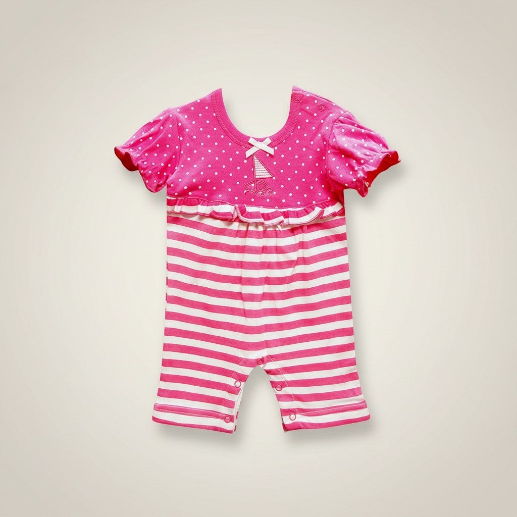 Pink and white striped baby romper with a matching top on a beige background