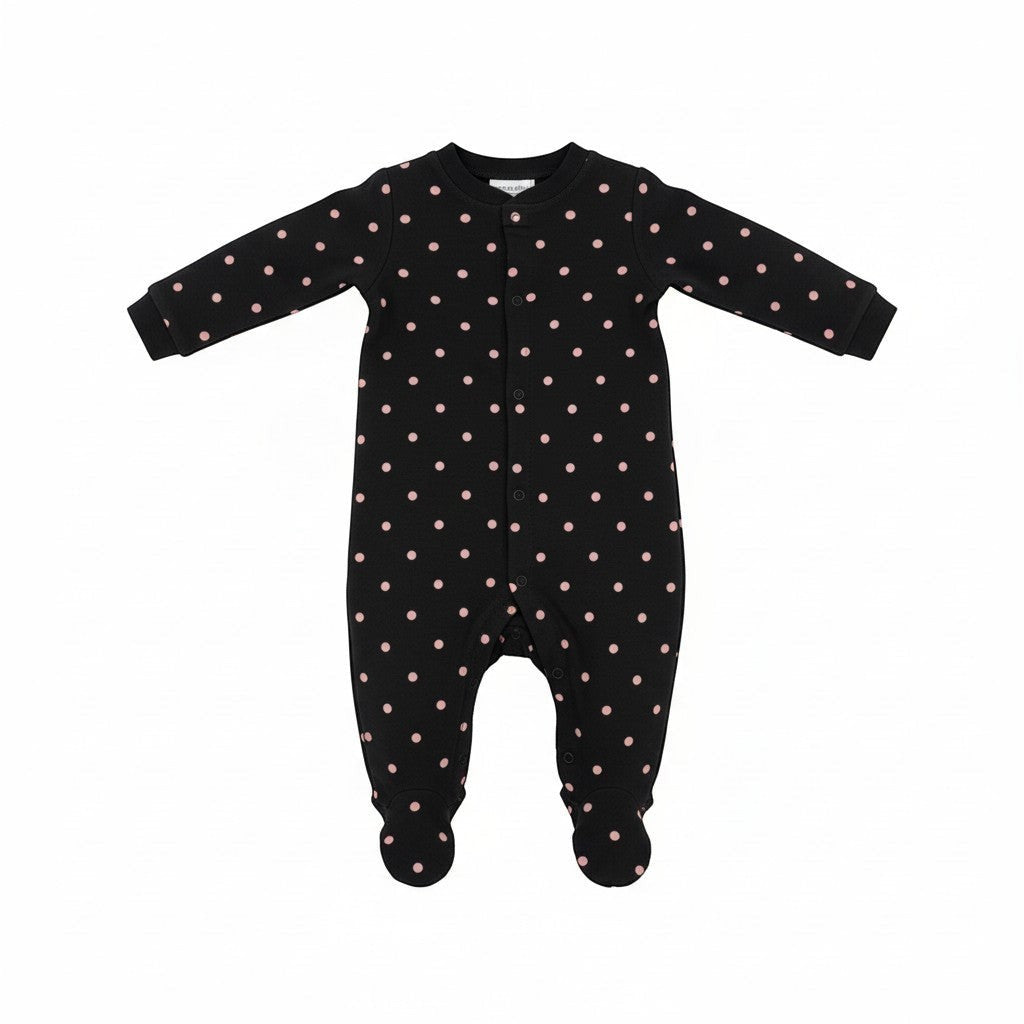 Black baby onesie with pink polka dots on a white background