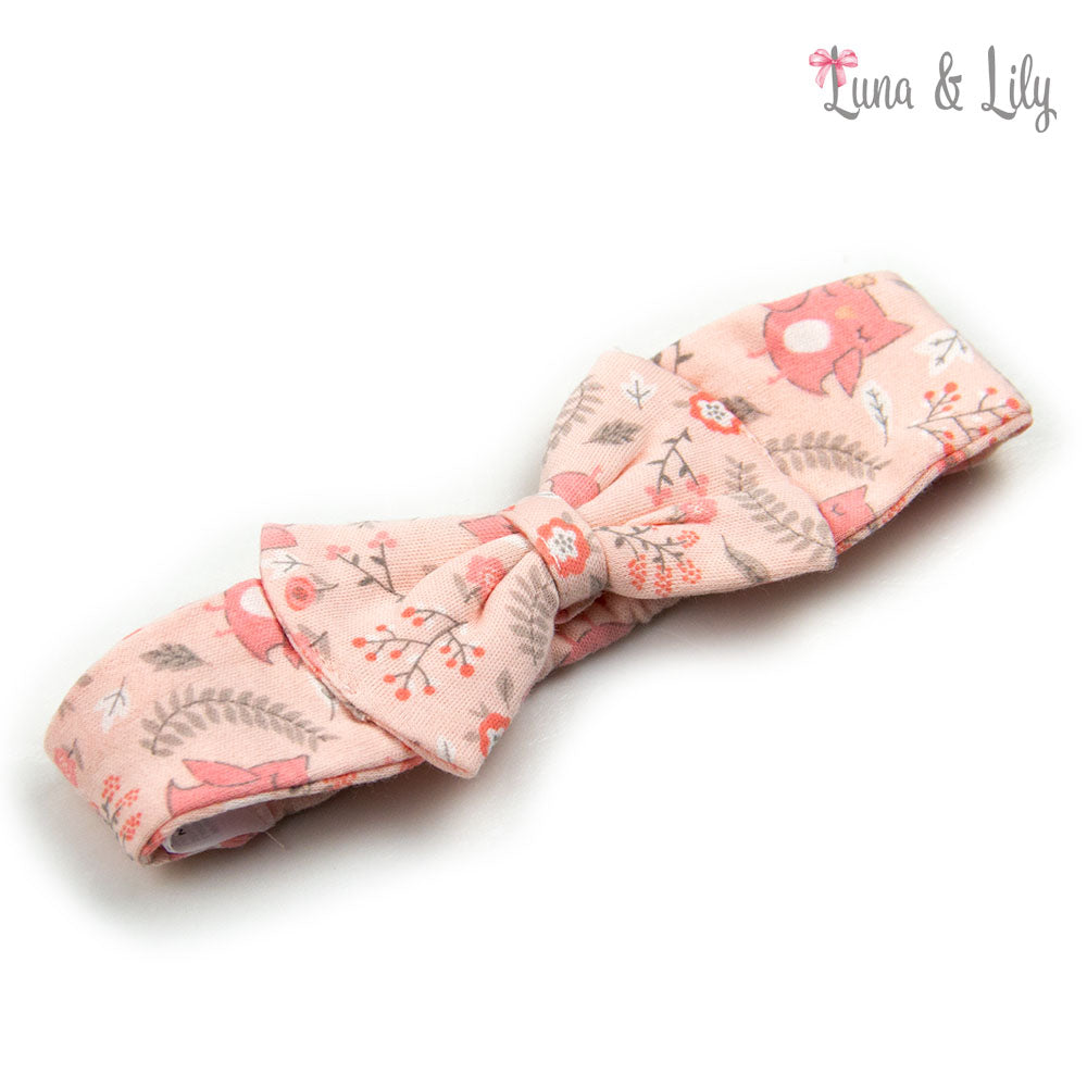 Pink fabric bow with nature-themed design on a white background, branded 'Luna & Lily'.