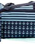 Navy blue and light blue striped bag with anchor pattern on a reflective surface