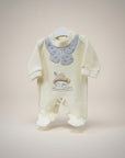 Baby onesie with embroidered design on a plain background