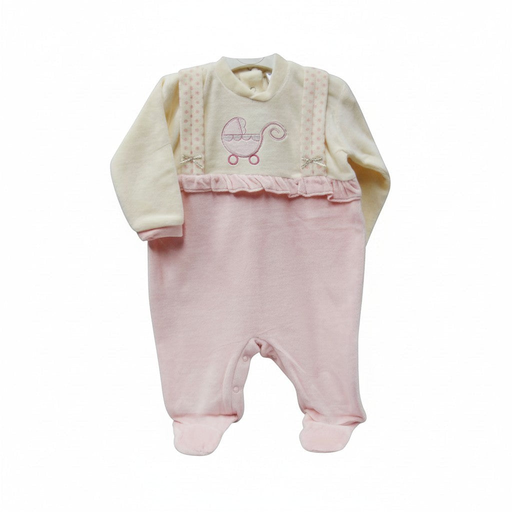 Pink baby outfit with cream top on a white background