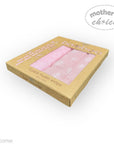 Box of pink bamboo muslin wraps with 'Mother's Choice' branding on a white background