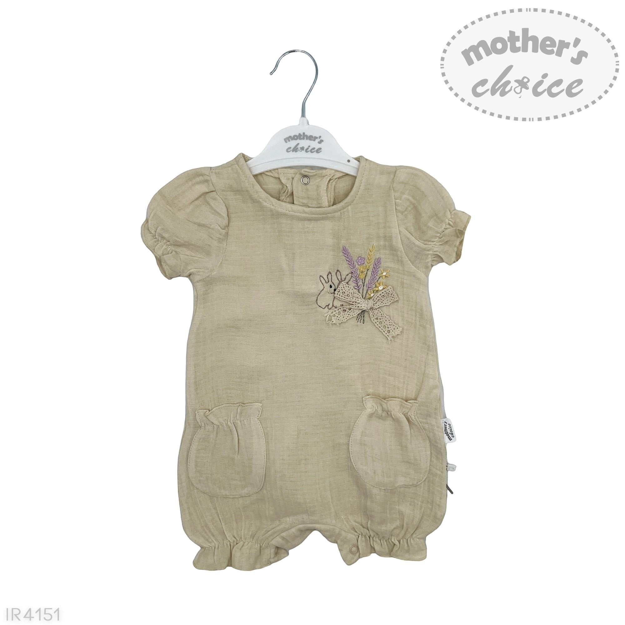 Beige baby romper with floral design on a hanger against a white background