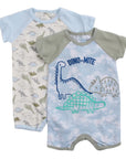 Two baby rompers with dinosaur designs on a white background