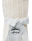 White textured blanket with a 'Mother's Choice' tag on a white background