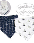 Two baby bibs with anchor and sailboat patterns, one in navy and white, the other in white and gray, with 'mother's choice' branding.