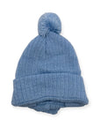 Blue knit beanie with a pom-pom on a white background