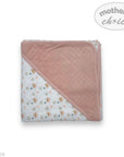 Folded baby blanket with pink and white design on a white background, featuring 'Mother's Choice' branding.