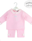 Pink baby outfit with ruffled collar on a hanger, branded 'Mother's Choice'.