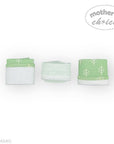 Three green and white patterned towels on a white background with 'mother's choice' branding.