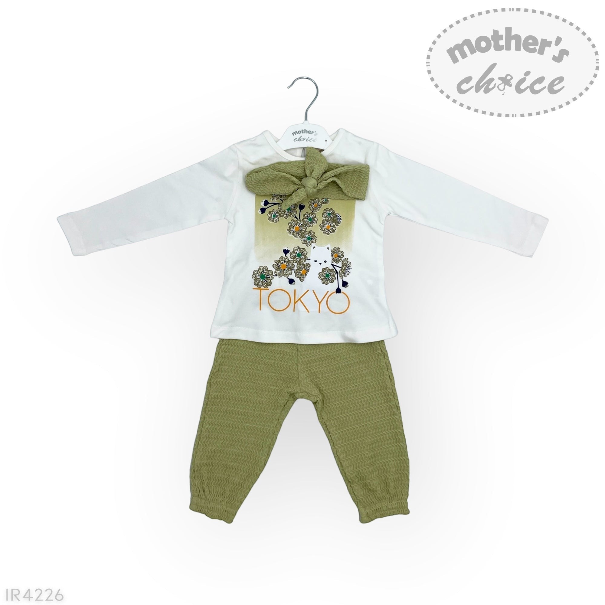 Baby outfit with white shirt, green pants, and 'Tokyo' design on a white background.