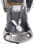 Gray baby high chair with tray and safety harness on a white background