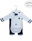 Baby outfit with white shirt and navy pants on a hanger, branded 'Mother's Choice'.