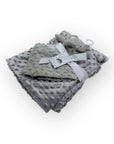 Gray textured blanket with a white tag on a white background