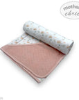 Roll of pink and white baby blanket with 'Mother's Choice' branding on a white background