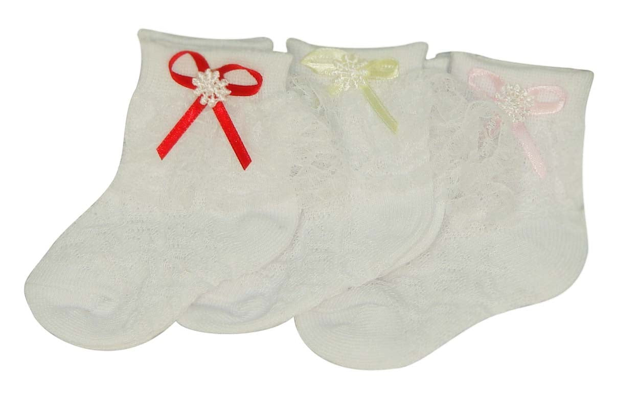 Three pairs of baby socks with decorative bows on a white background