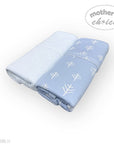 Folded blue blanket with white patterns on a white background, featuring 'mother's choice' branding.