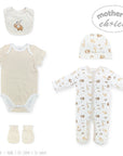 Baby clothing set with onesie, hat, and booties on a white background