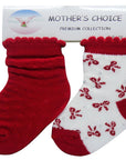 Red and white baby socks with floral pattern on a 'Mother's Choice' branded card.