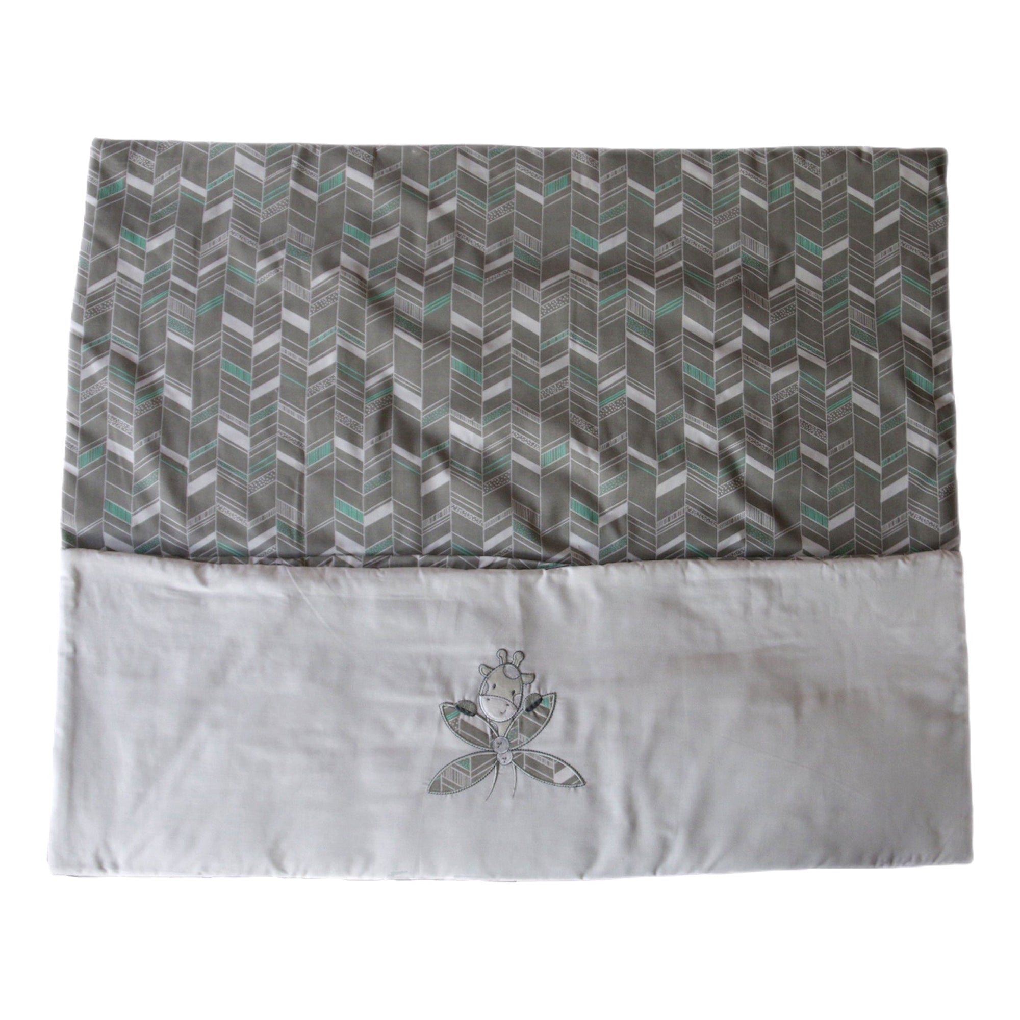 Patterned fabric with a white border and embroidered design on a white background