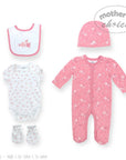 Baby clothing set with pink onesie, white bodysuit, bib, hat, and mittens on a white background.