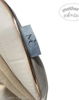 Close-up of a beige baby seat with a 'mother's choice' tag on a white background
