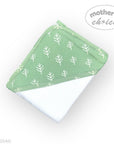 Green baby bib with white leaf pattern on a white background, branded 'Mother's Choice'.
