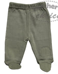 Green baby pants with footies on a white background