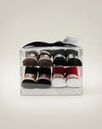 Stork And Baby 4 pack baby socks in PVC gift box featuring brown, black, and white designs with basketball and red accents.
