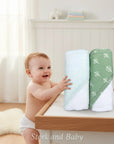 Stork and Baby Mothers Choice 2-pack sage green bamboo hooded towels with acorn and leaf prints.