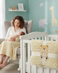 Stork And Baby beige cable knit shawl with teddy bear tag, 75x100cm, perfect for newborns.