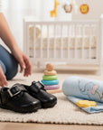 Stork And Baby black faux leather boys velcro shoes with buckle detail, perfect for everyday wear.
