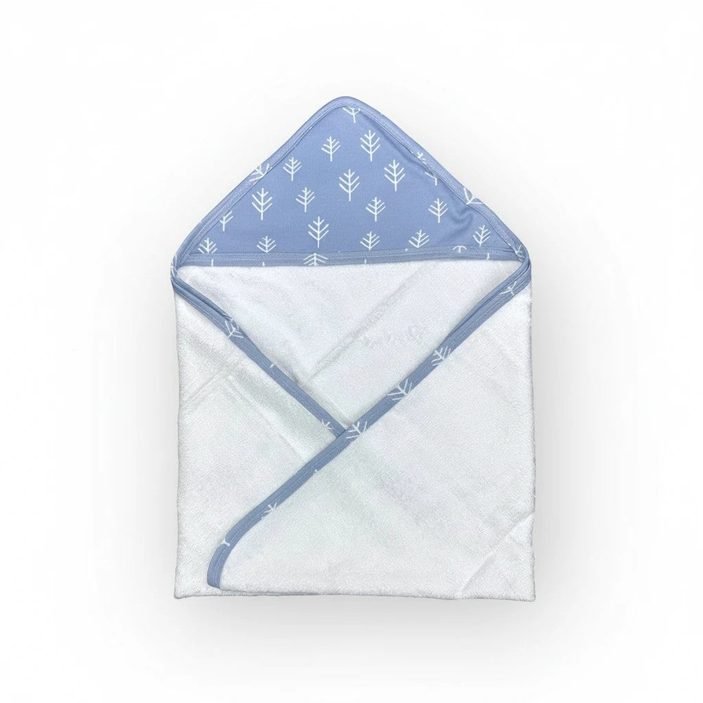 Stork And Baby blue bamboo hooded towel with white tree pattern on hood. Soft and absorbent for babies.