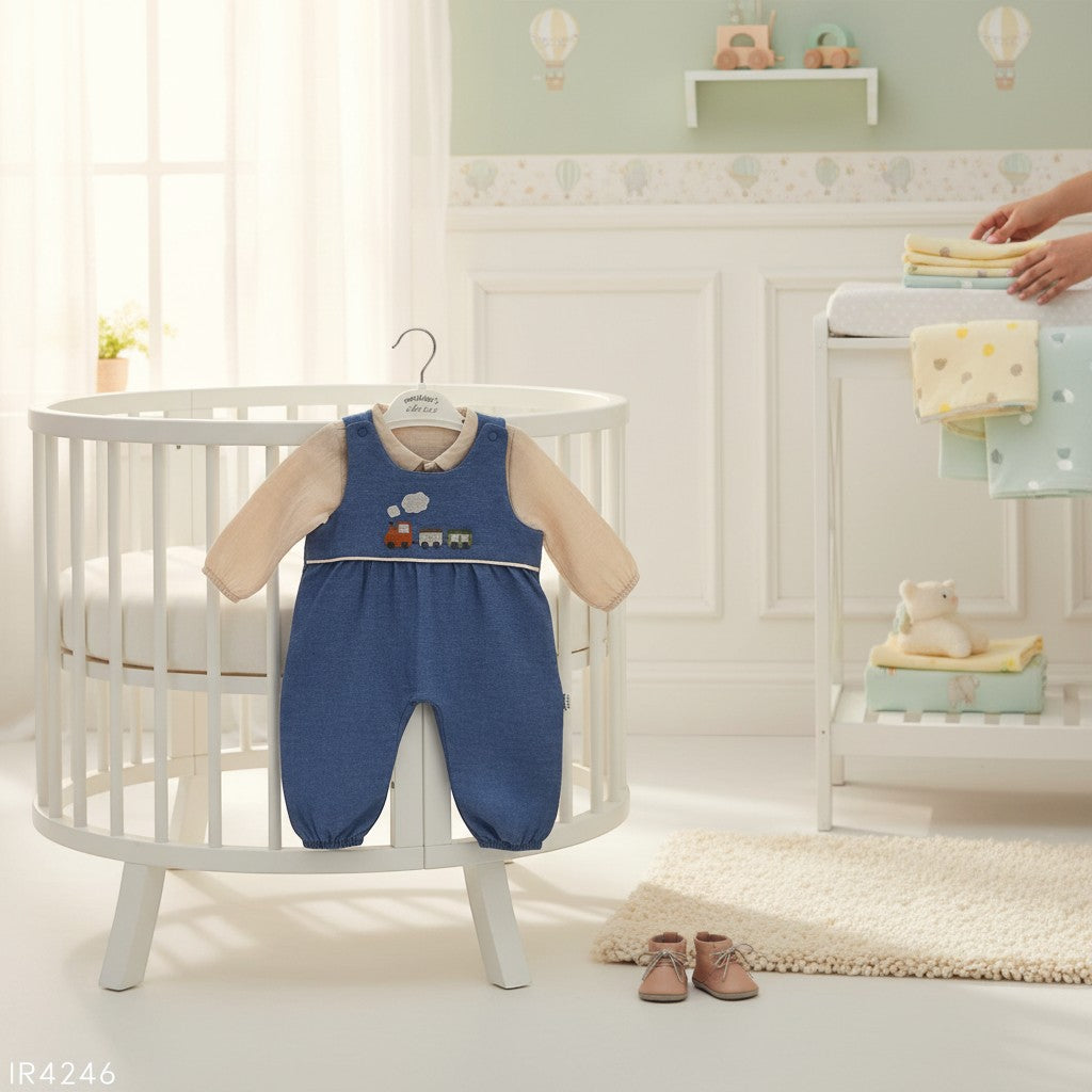 Stork And Baby blue denim dungaree set with a cream long-sleeved top, featuring train embroidery. Perfect for toddlers.