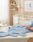 Stork And Baby light blue knitted pram suit set with hat and mittens, featuring a waffle knit texture and button closure.